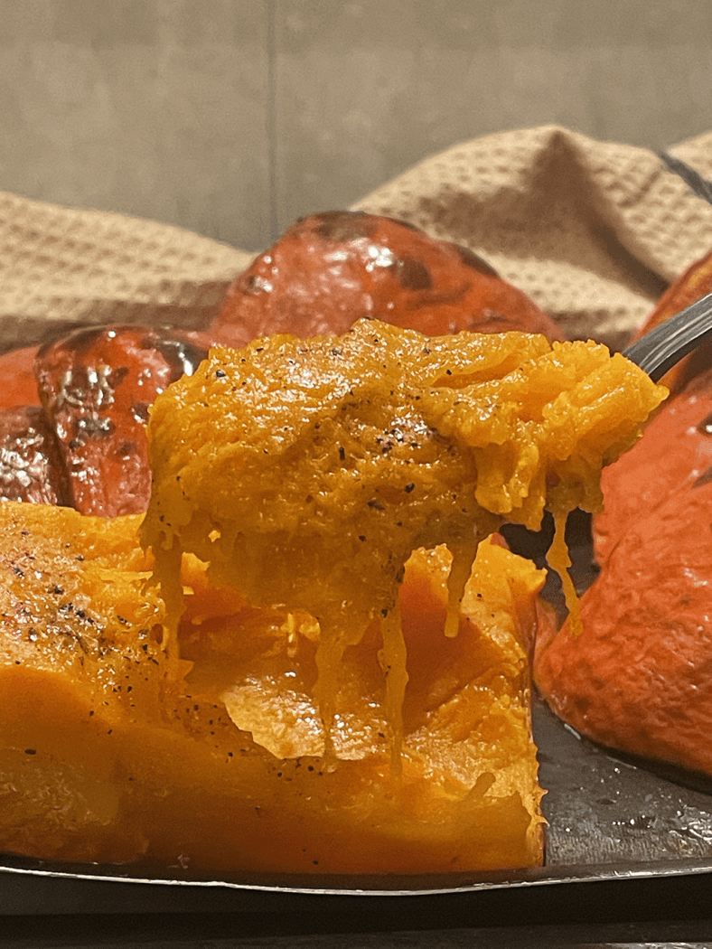 red kuri squash on a spoon