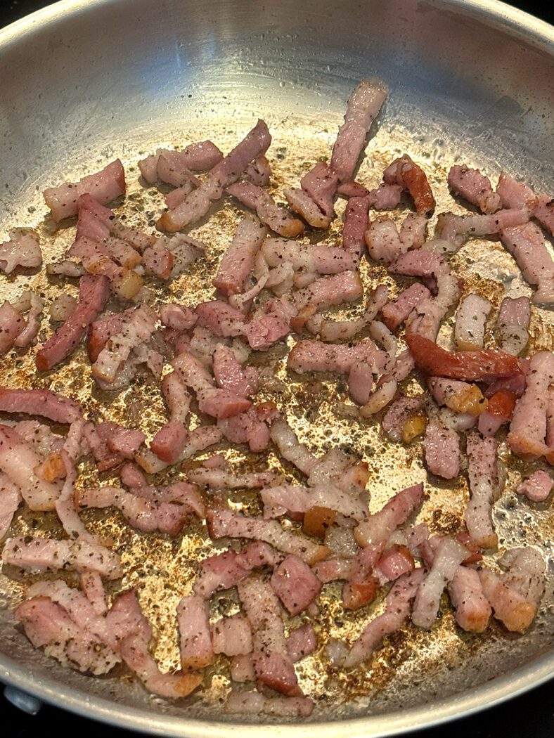 Peppered lardons frying