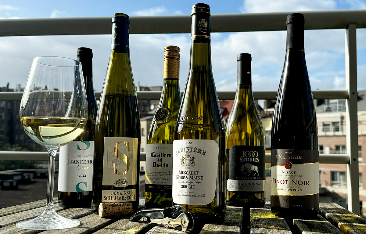 bottles of wine on a table outside