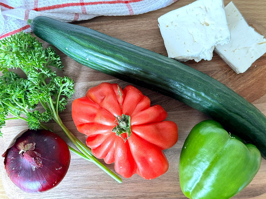 Vegetables and cheese on a cutting board 