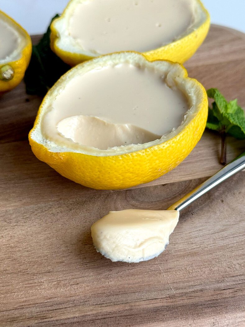 Posset on a spoon on a cutting board