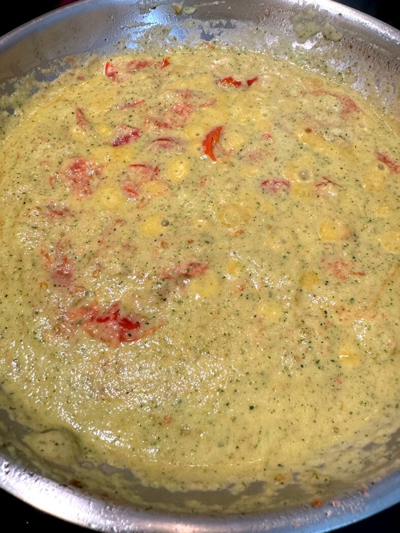 Pureed zucchini and cherry tomatoes in a pan