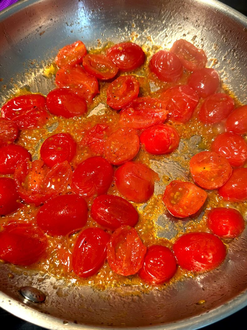 Tomatoes frying in a pan